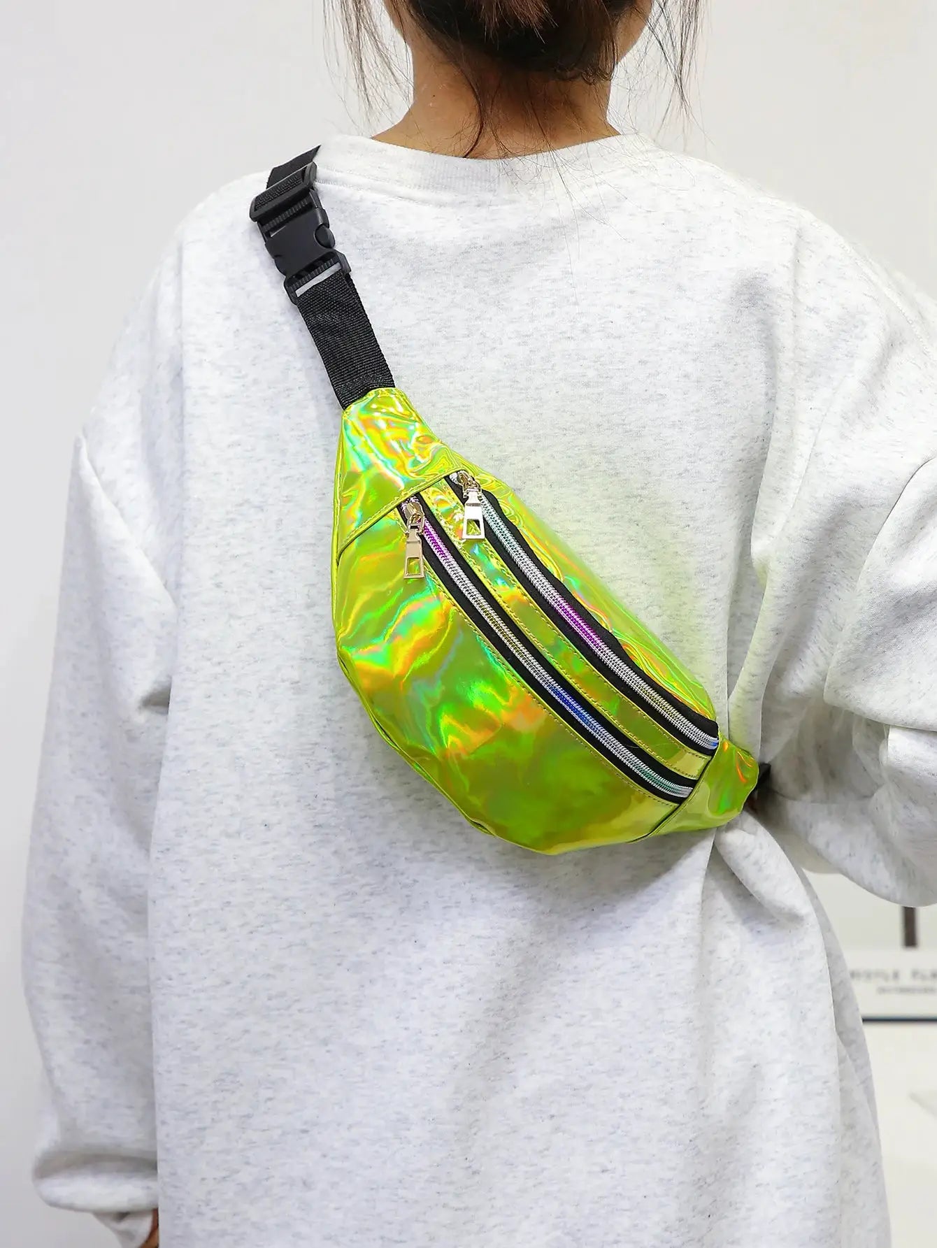Holographic fanny pack by Simples Market; iridescent PU waist bag with black strap and dual zippers.
