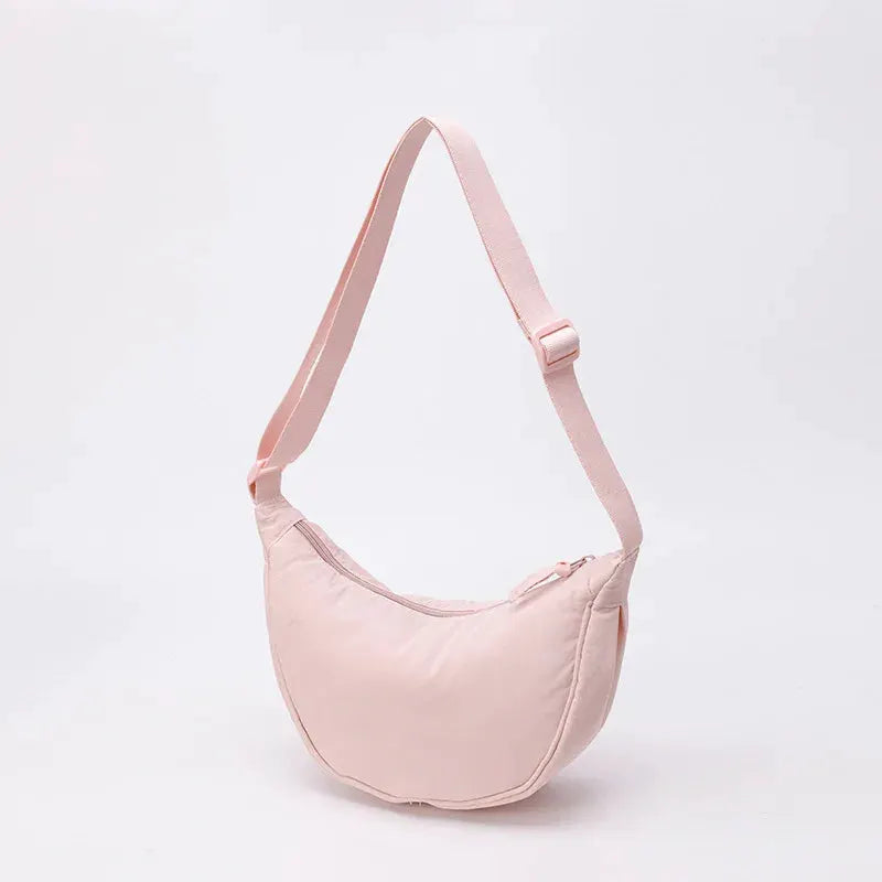 Simples Market nylon crossbody bag, crescent dumpling shape, pale pink with adjustable strap