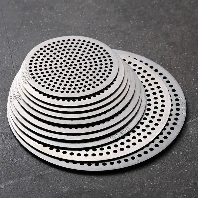 Drain hair catcher discs by Simples Market; stainless steel perforated filters for kitchen sink and bathroom.