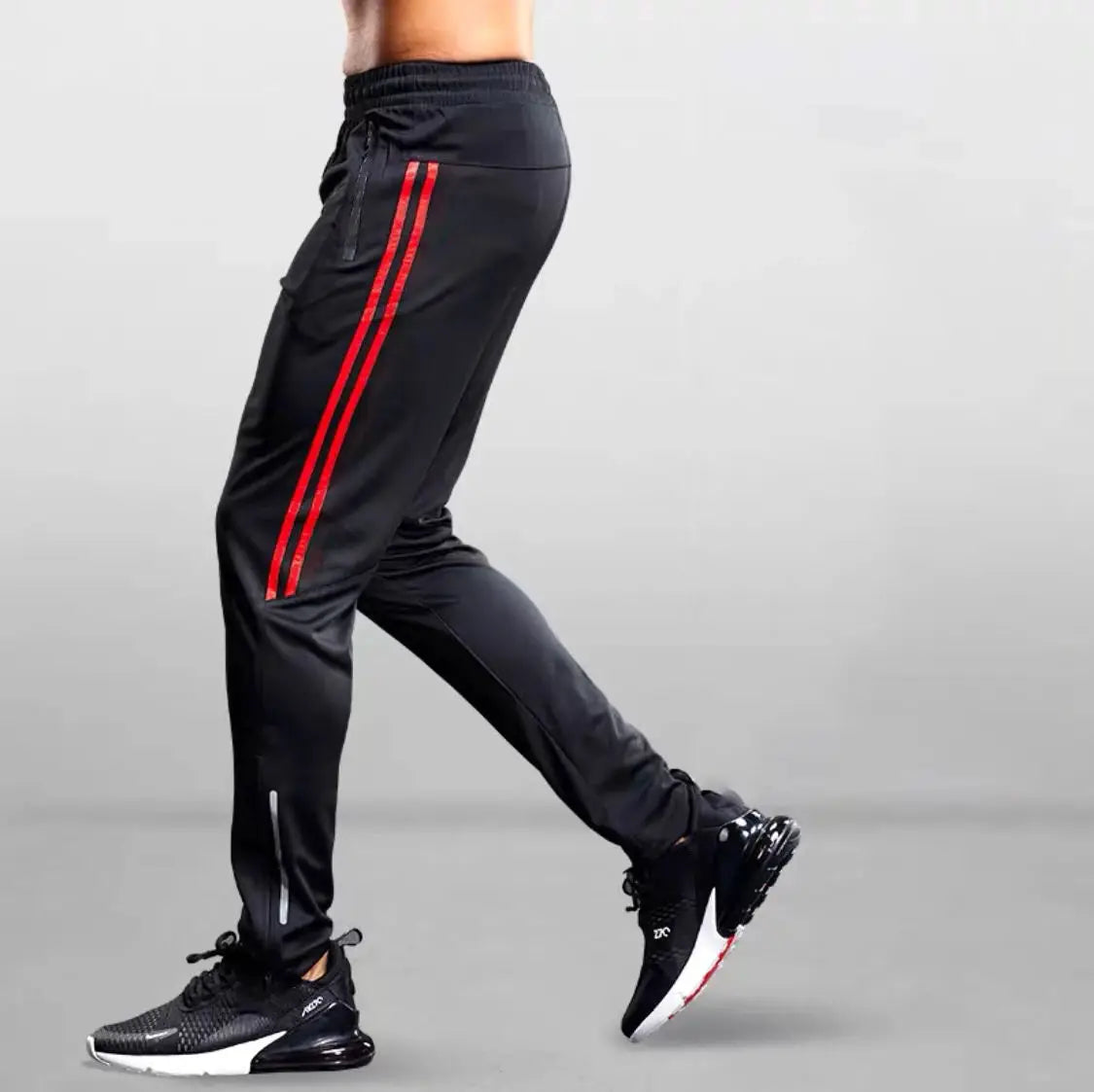 Men's black jogging pants with red side stripes for gym and running