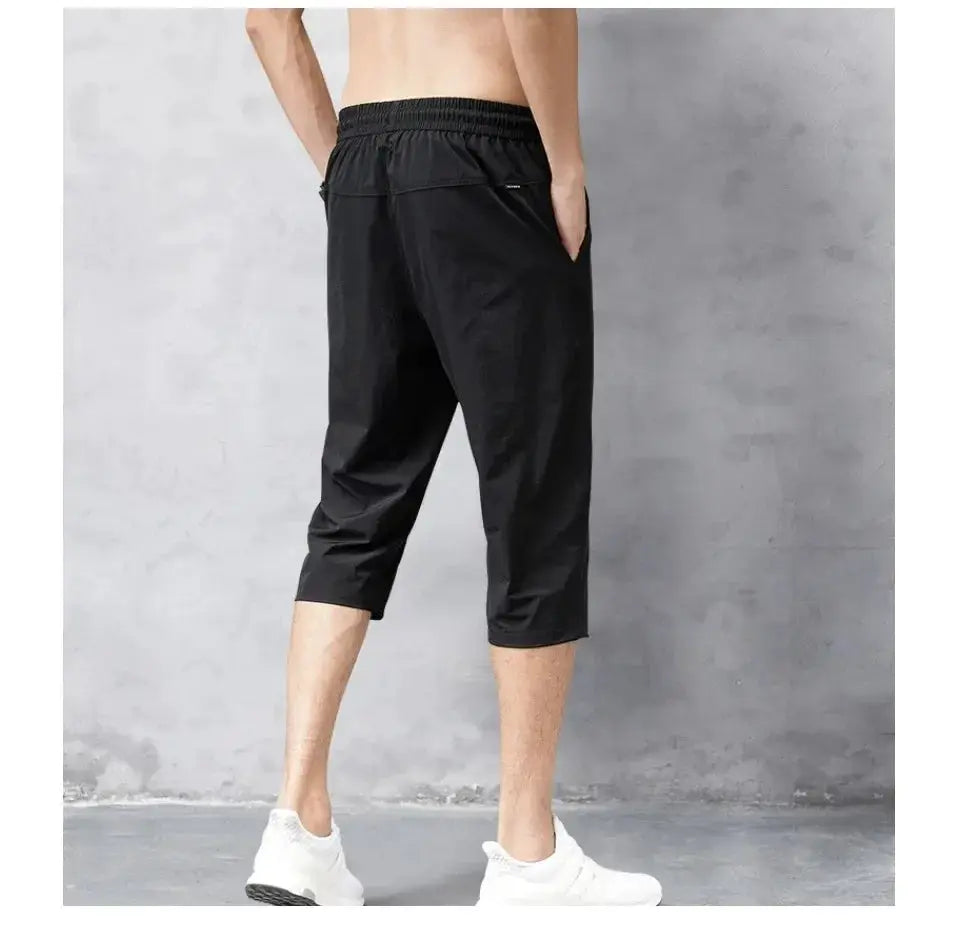 3/4 Length Men's Shorts in black, quick-dry nylon with elastic waistband
