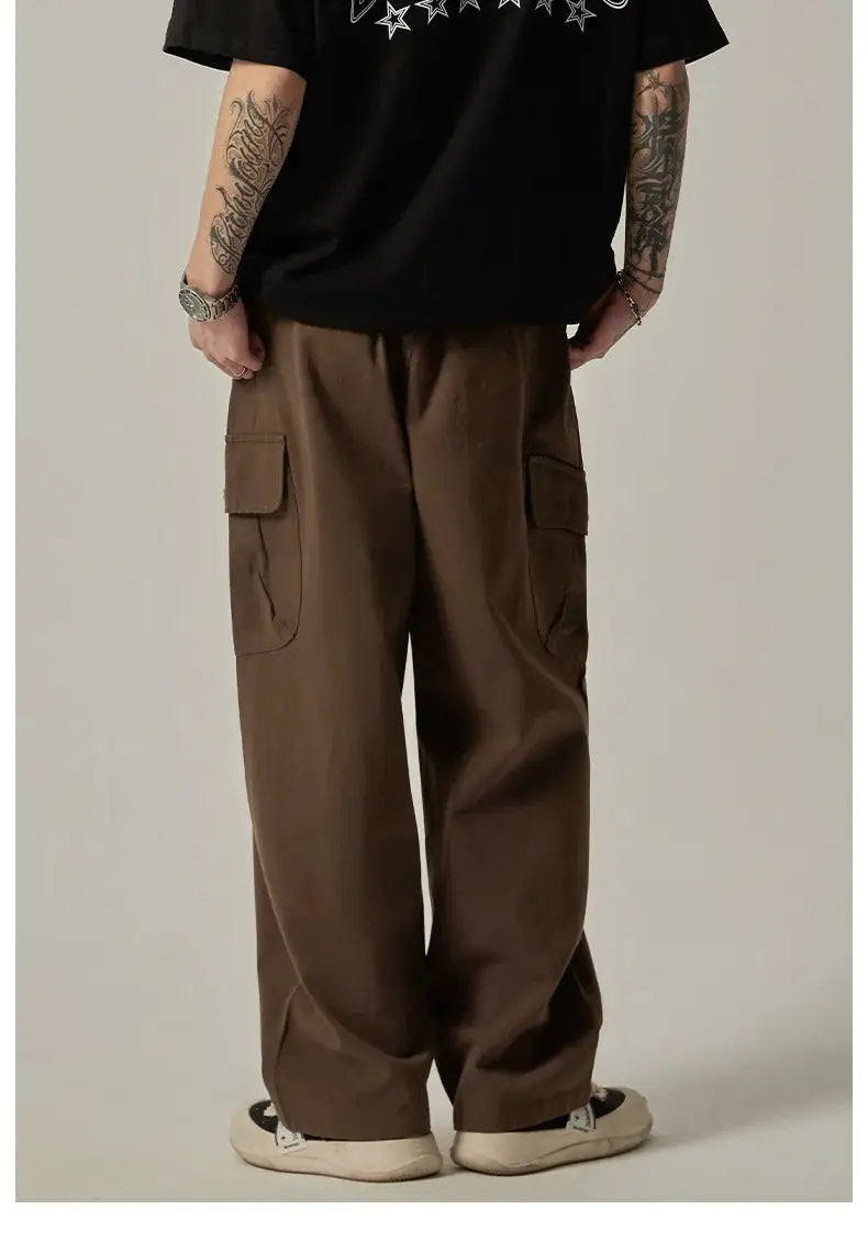 Men's brown cargo sweatpants with large pockets, wide-leg straight fit, drawstring waist.