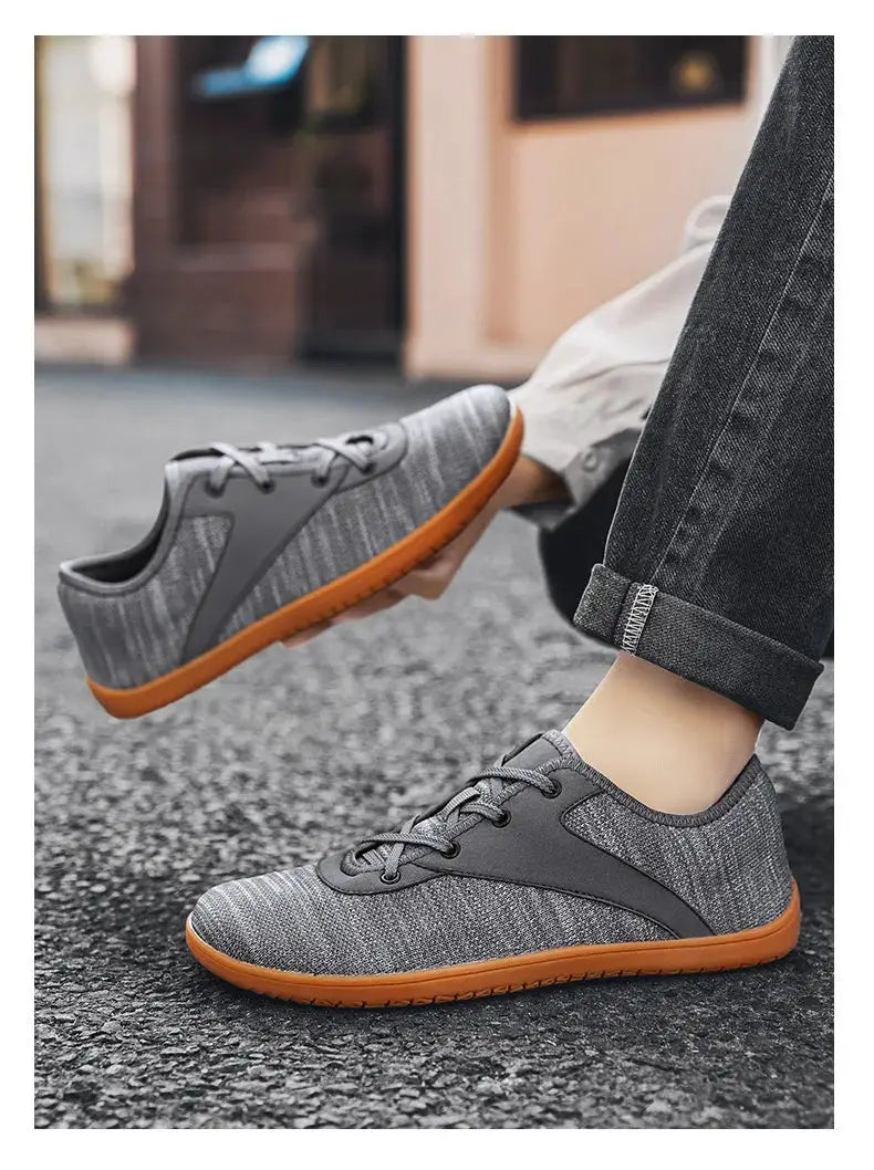 Simples Market grey knit trail running shoes with orange outsole, minimalist zero-drop design