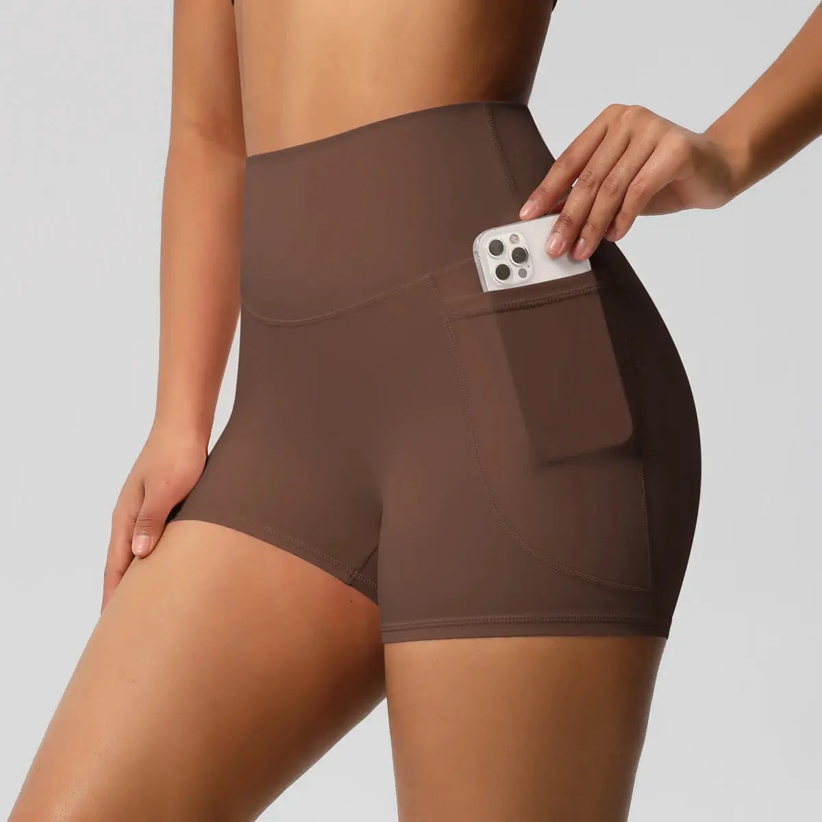 Simples Market women's pocketed sport shorts in brown, high-waist, quick-dry yoga/fitness tight fit.