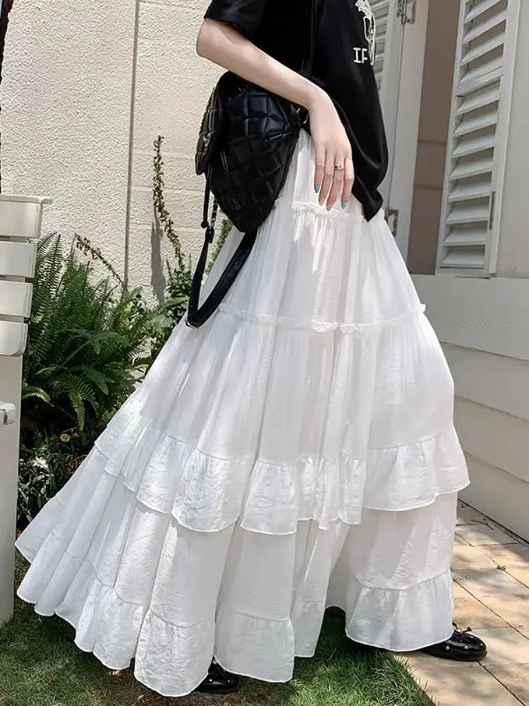 White tiered ruffle-hem maxi skirt with high waist and flowing chiffon layers
