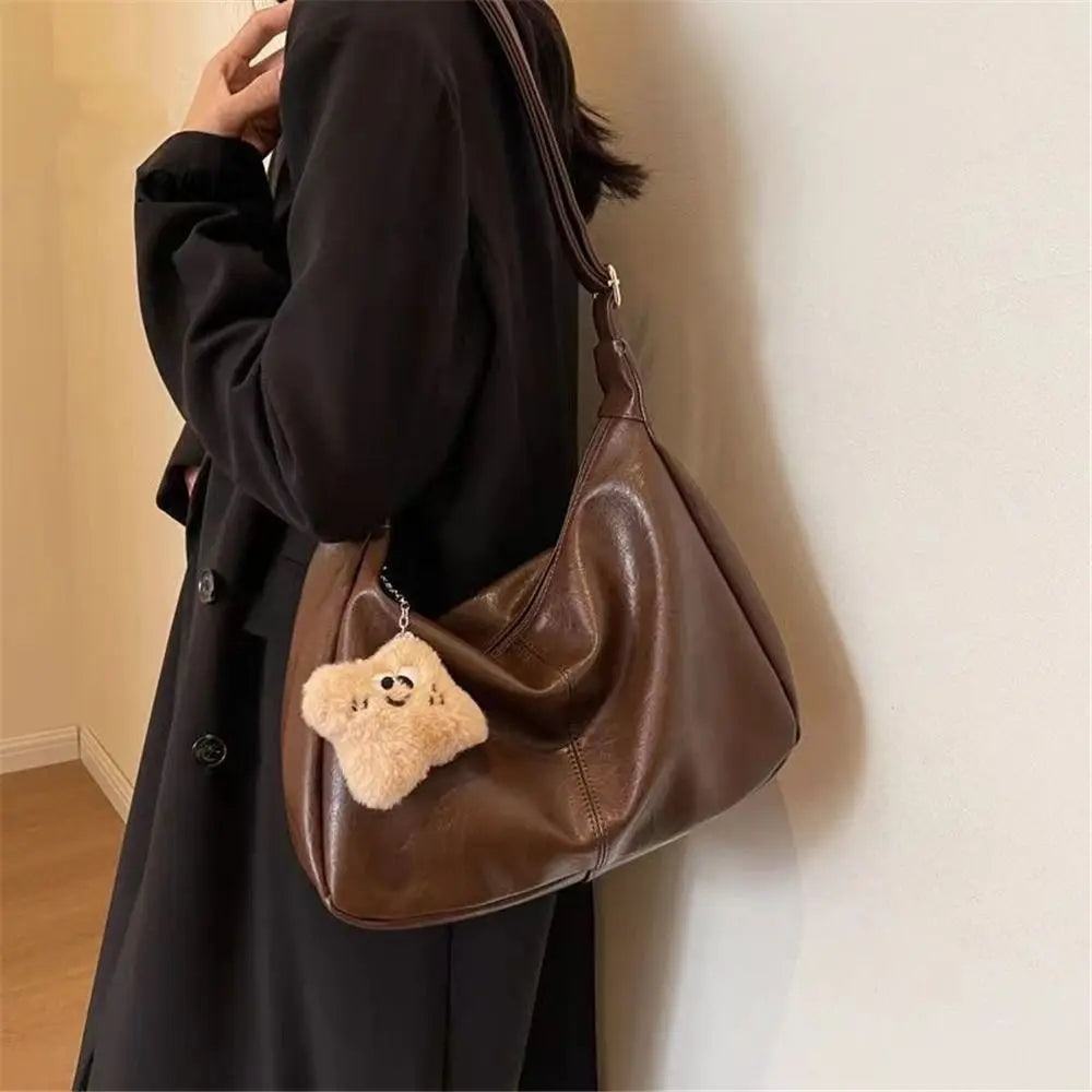 Simples Market brown PU leather slouchy shoulder bag for women with large capacity and teddy bear keychain