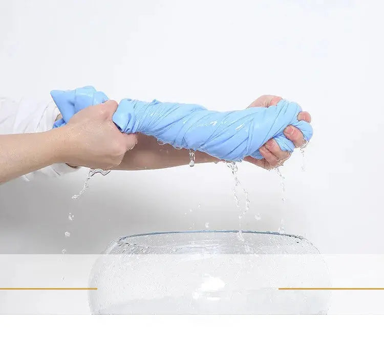 Blue men's short-sleeve dress shirt being wrung out with water droplets