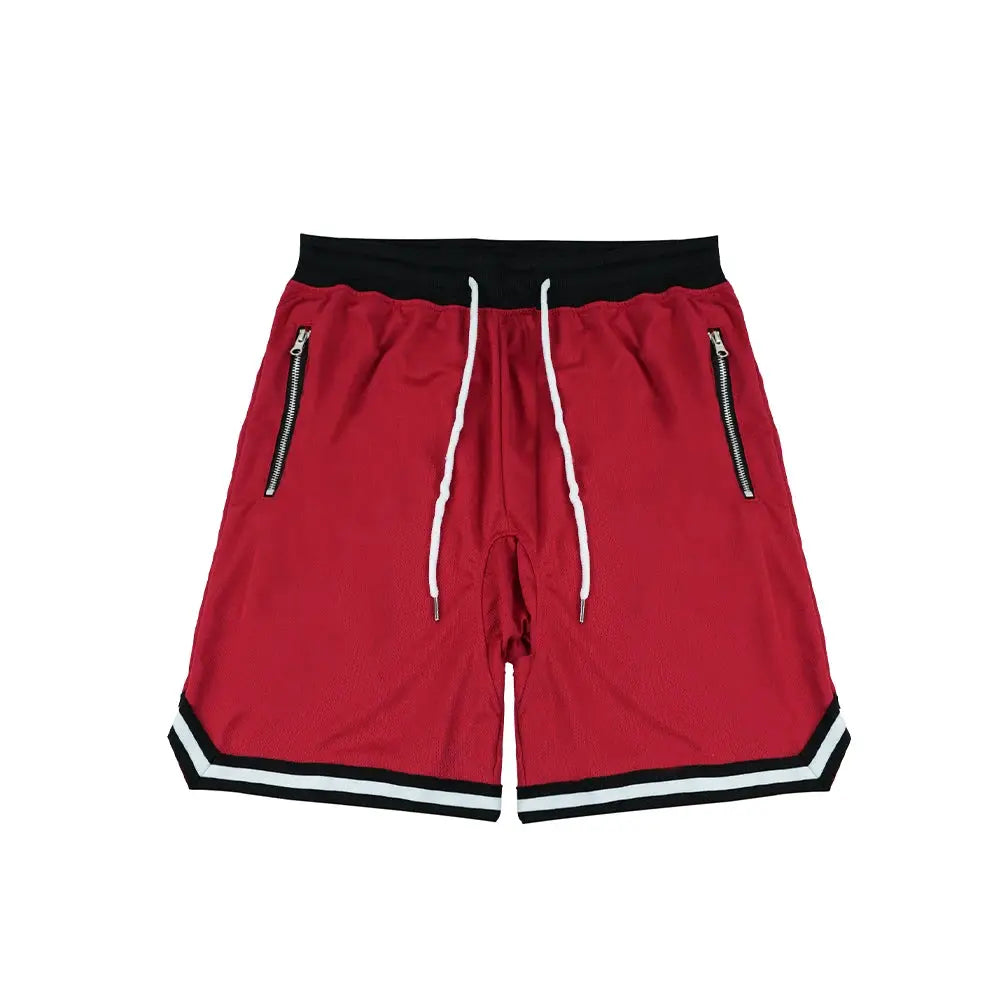 Men's red basketball shorts with black waistband, white drawstrings, zip pockets, and striped hem
