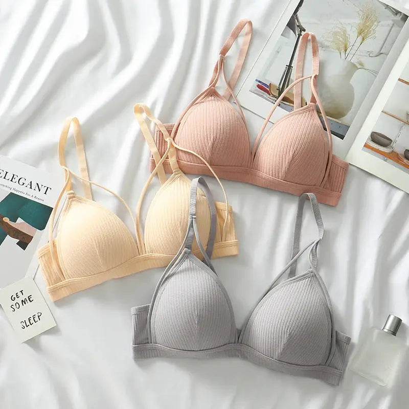 Wire-free triangle-cup bralettes set of three in peach, beige, and gray.