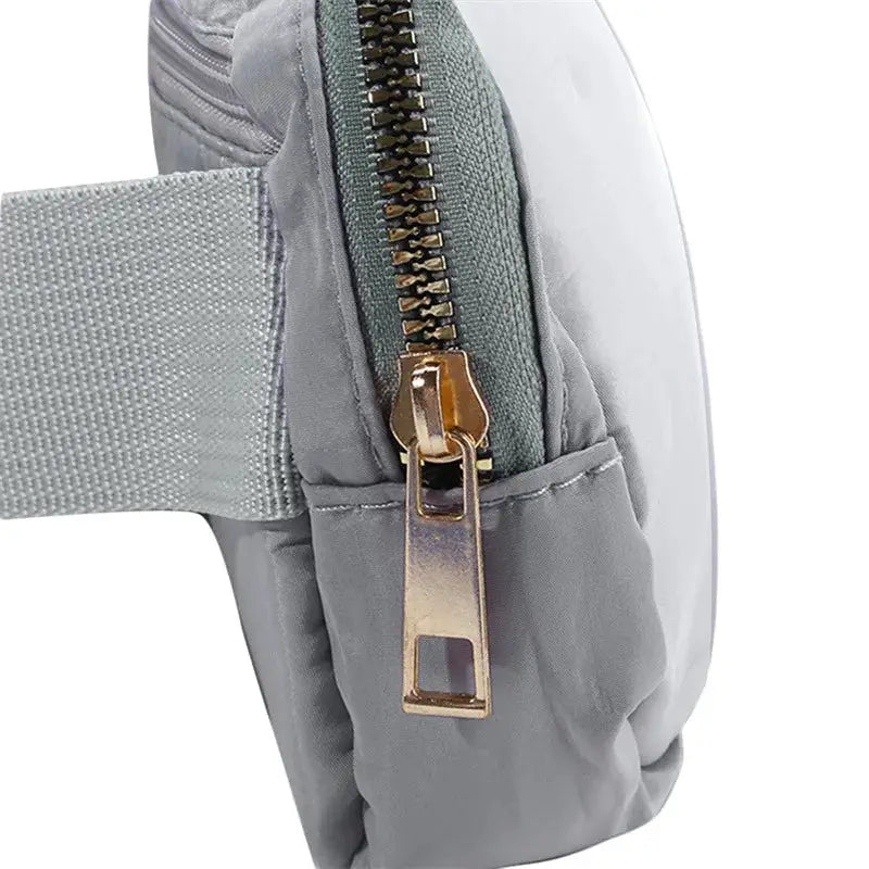 Simples Market waist bag (fanny pack) in grey with gold zipper and adjustable strap