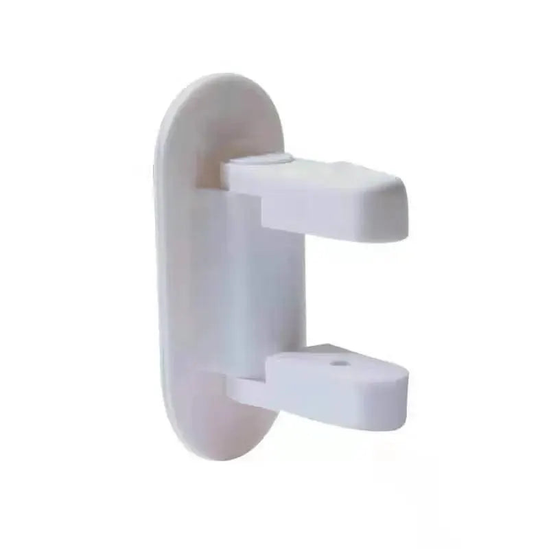 White plastic door lever safety lock with adhesive mounting and dual arms for childproofing.
