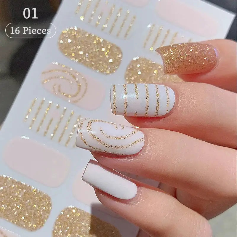 Press-on nail decals, 16 pieces, white and pale pink bases with gold glitter stripe designs, self-adhesive