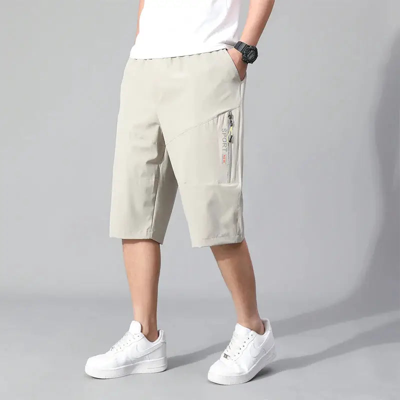 Men's cargo shorts knee-length, beige cotton with zip pocket and elastic waist.