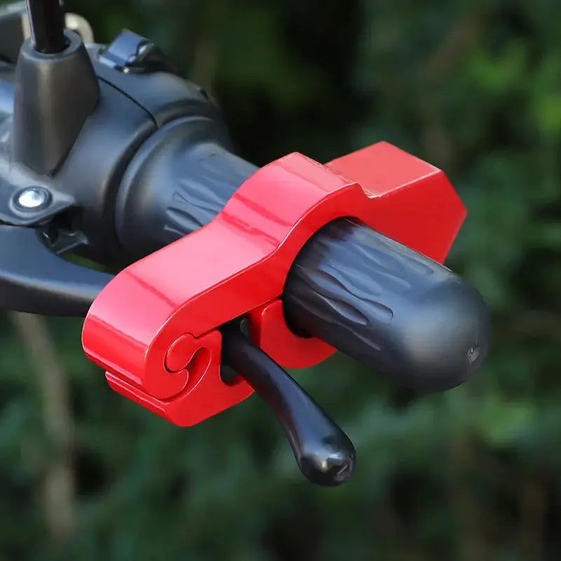 Motorcycle handlebar lock clamp in red on a grey throttle grip with brake lever