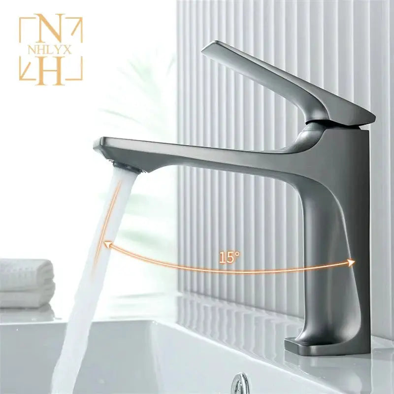 Brass-core modern bathroom sink faucet, single-handle deck-mounted hot and cold mixer in metallic gray.