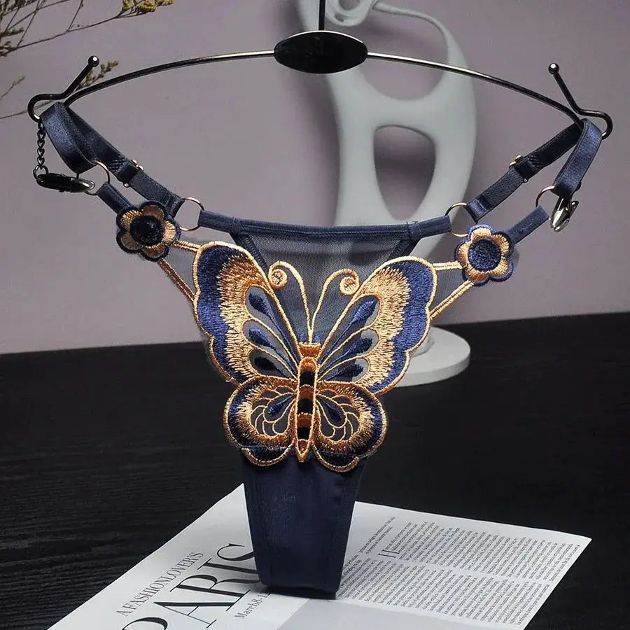 Butterfly lace thong by Simples Market, navy blue low-waist G-string with embroidered butterfly design.