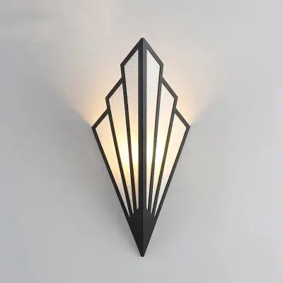 Nordic black iron wall lamp with geometric diamond design and warm LED glow