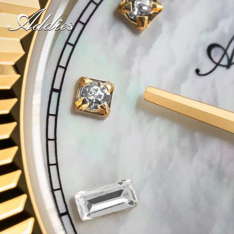 Addies luxury women's watch with gold-tone bezel and crystal hour markers on a mother-of-pearl dial