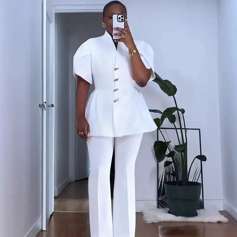 Women's white two-piece vintage office suit with puff-sleeve blazer and wide-leg pants by Simples Market