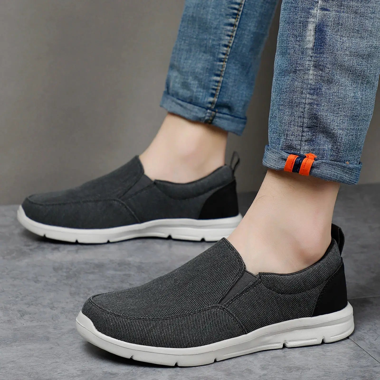 Men's black canvas slip-on sneakers with breathable design and white sole
