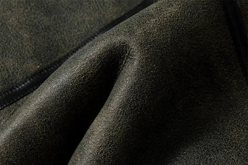 Leather fur jacket by Simples Market; dark brown textured leather close-up.
