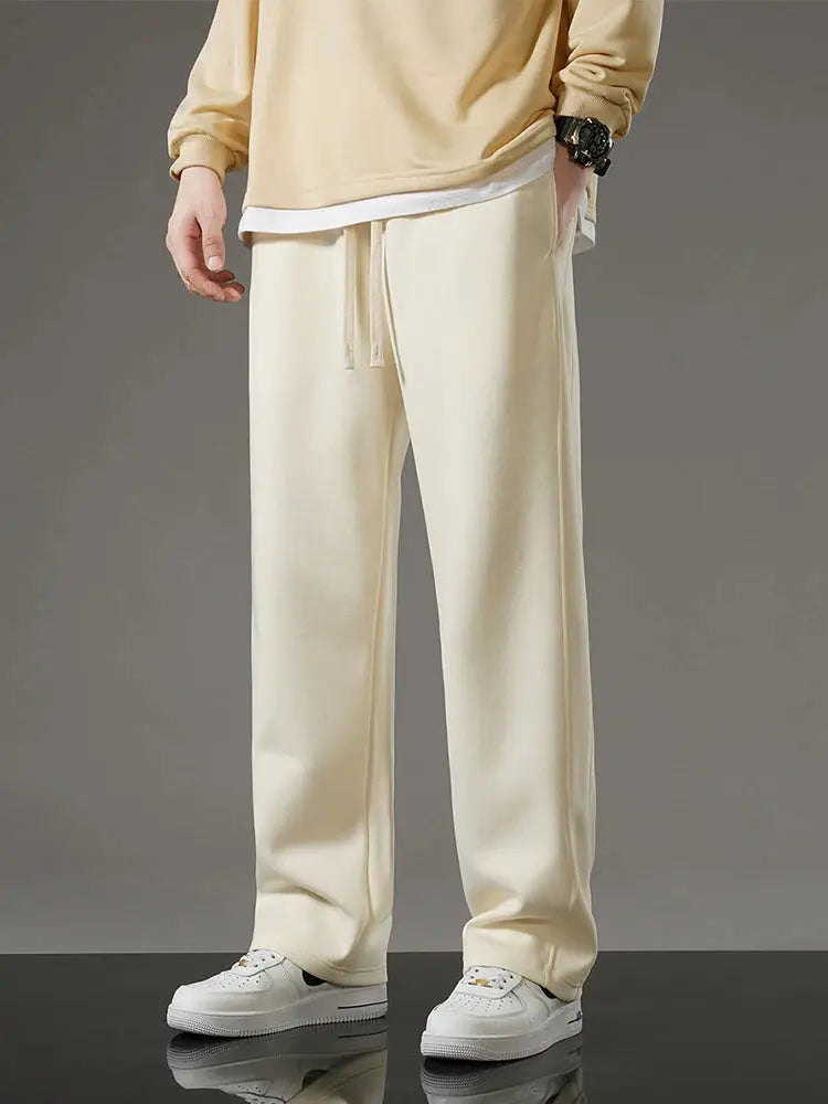 Men's cream cotton sweatpants with drawstring, wide-leg casual track pants.