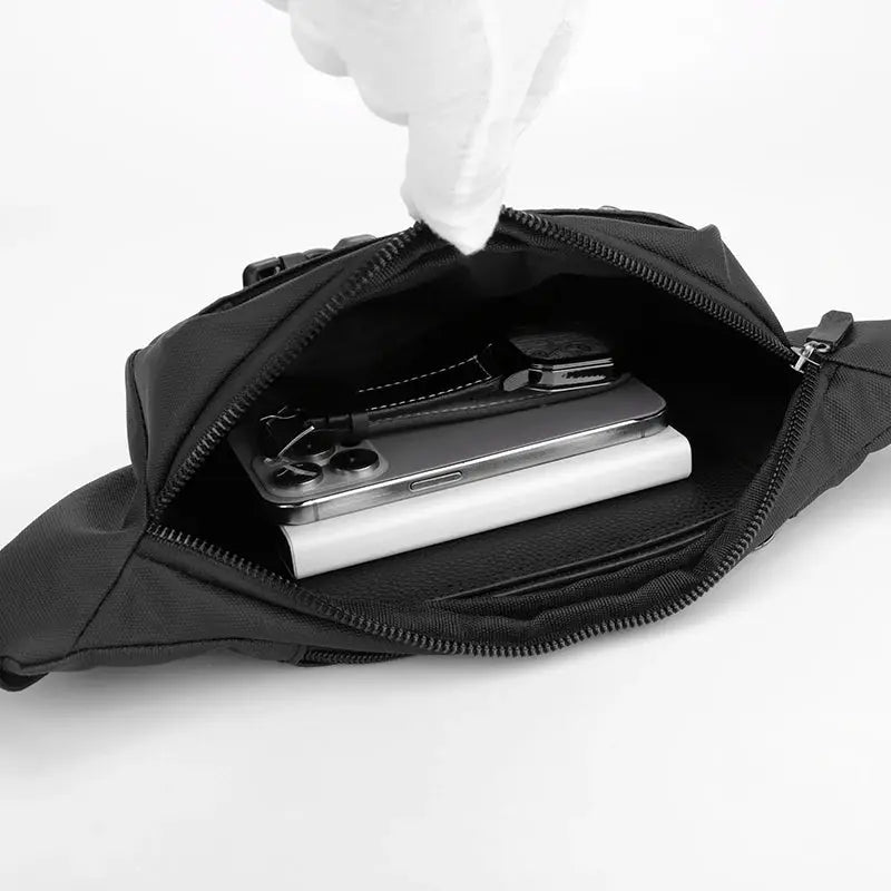 Unisex waterproof black waist bag open to reveal a smartphone in the main pocket