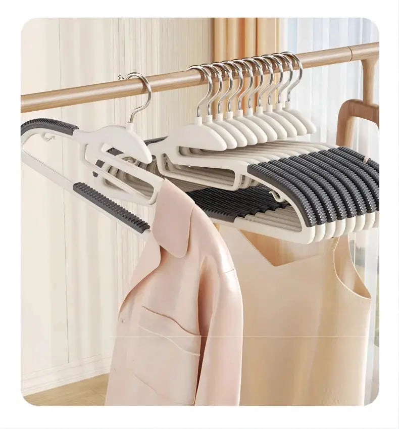 10Pcs white multifunctional wet and dry hangers with grey anti-slip grips on wardrobe rail