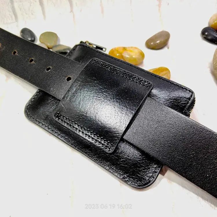 Mini black leather waist bag by Simples Market with belt strap and front ID card holder.