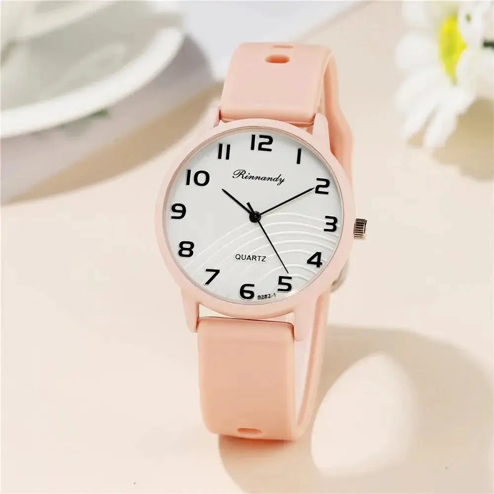 Pink silicone-band women's watch with white dial, Arabic numerals, Rinnandy quartz
