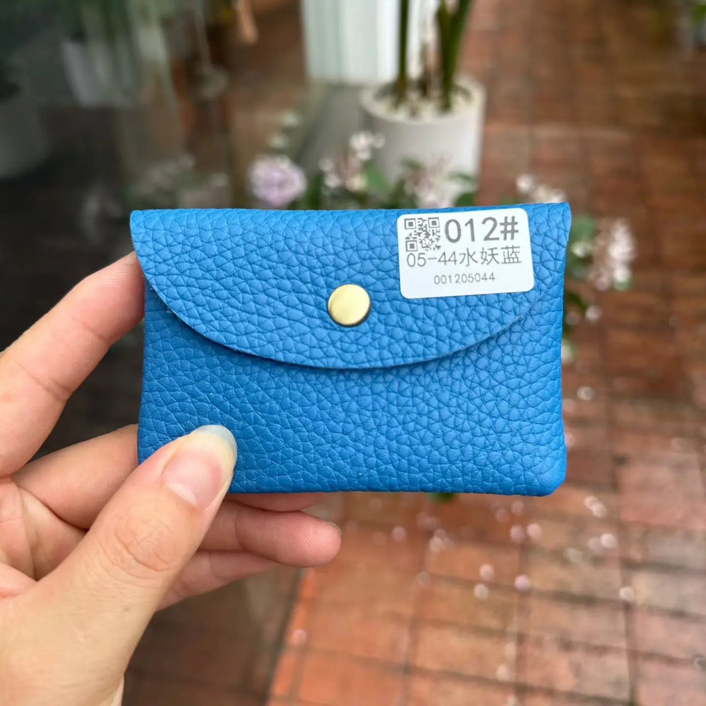 Simples Market blue pebble-grain leather card holder with snap closure