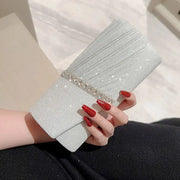 Simples Market silver sequin clutch bag with crystal-embellished band for evening events