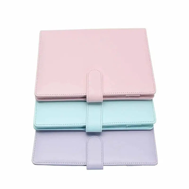 Three pastel leather-look notebook file folders with strap closures