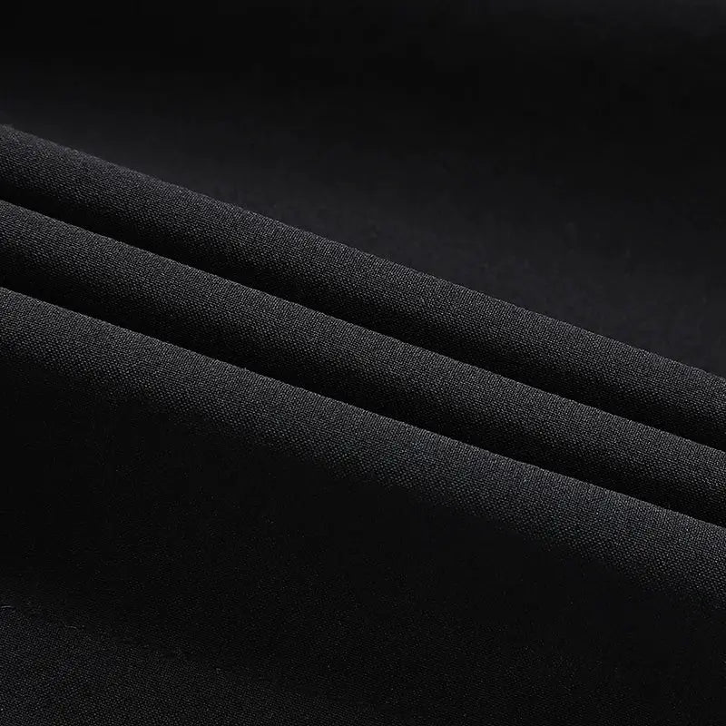 Men's black quick-dry athletic shorts fabric close-up, lightweight breathable material