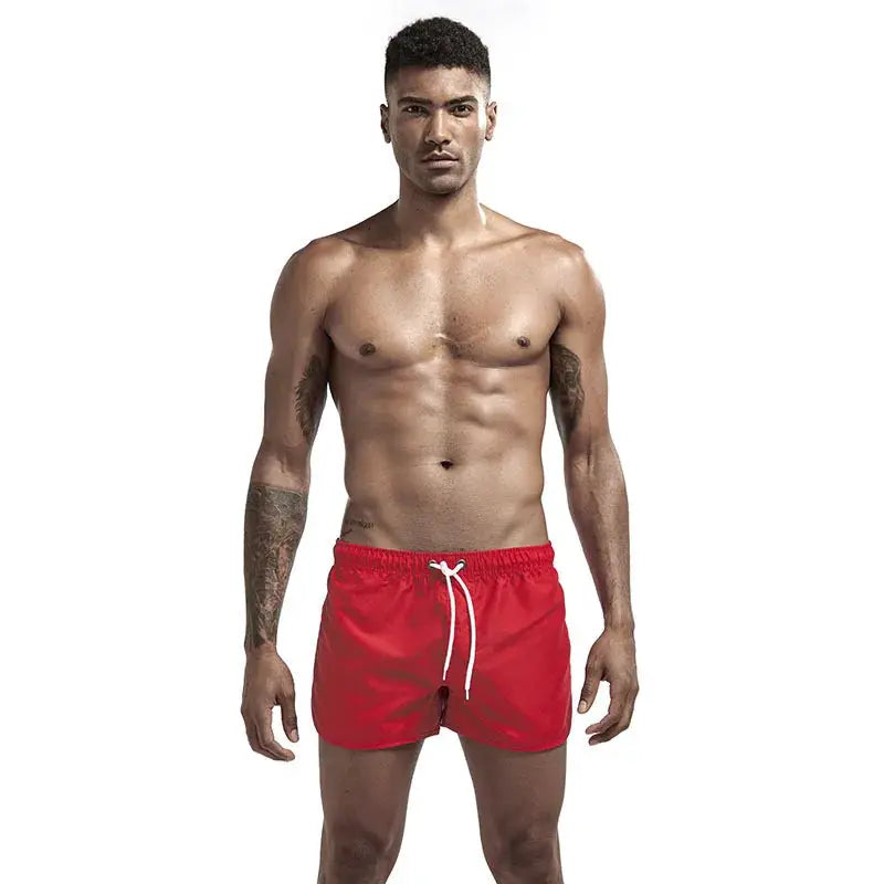 Swim trunks for men by Simples Market, red quick-dry board shorts with white drawstring