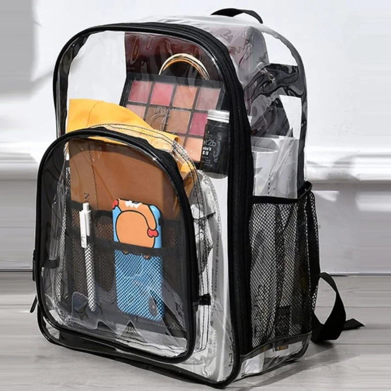 Clear backpack with black trim; large transparent school bag showing makeup palette, water bottle, and notebook inside.