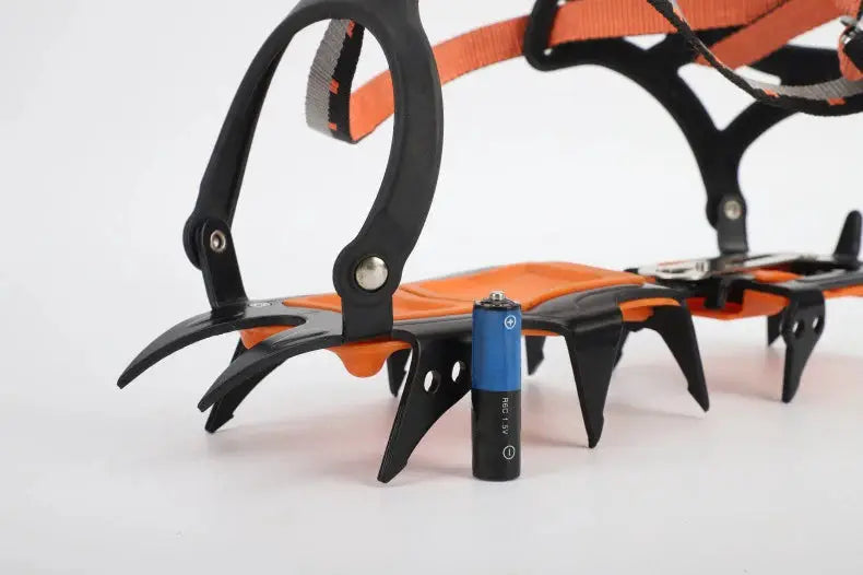 Simples Market 12-tooth ice crampons pair with orange straps and stainless steel spikes