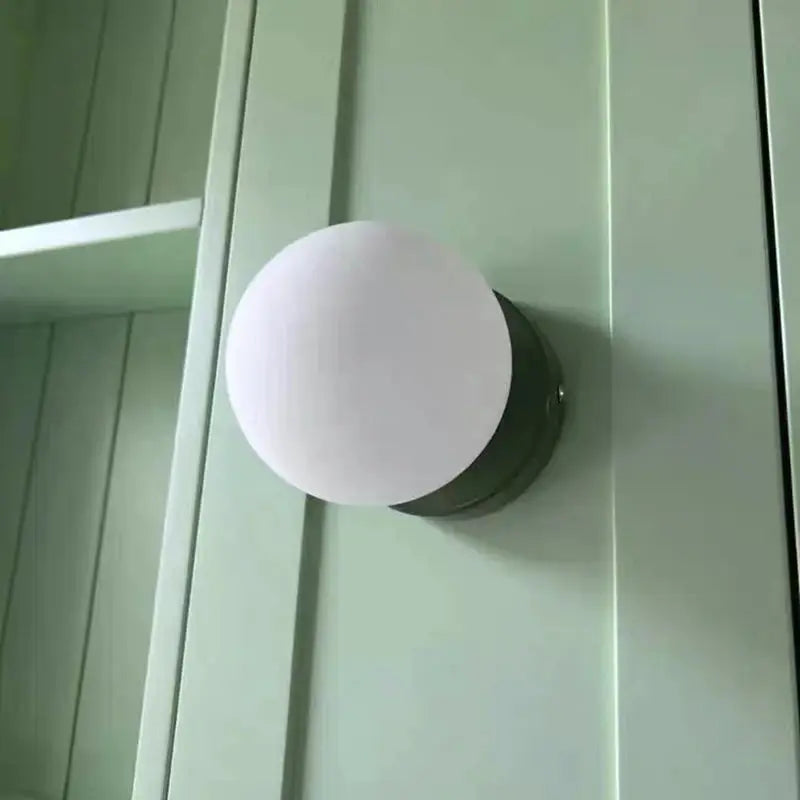 Macaron wall lamp with white frosted plastic ball lampshade on iron base; modern home decor