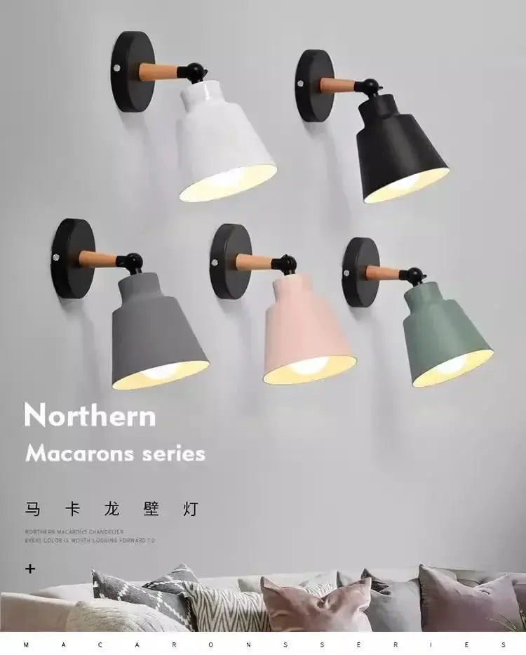 Six Nordic solid-wood LED wall lamps mounted on the wall in mixed colors for bedroom or living room decor.