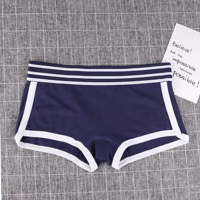 Women's navy low-waist boxer boyshort panties with white trim and striped waistband.