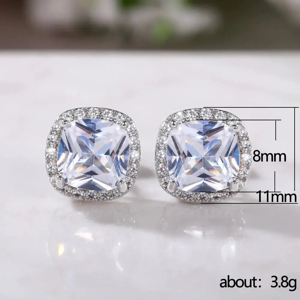 Huitan cushion-cut stud earrings with a brilliant cubic zirconia halo in silver-tone setting; pair