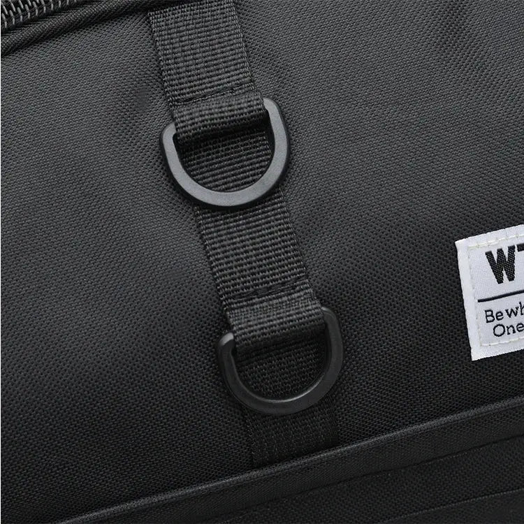 Oversized black handbag with webbing strap and metal D-rings