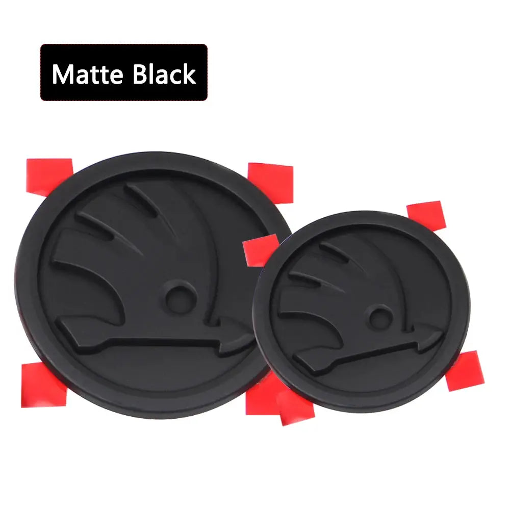 Matte black ABS round car badge emblems with red mounting tabs, 80mm and 90mm, set of 2