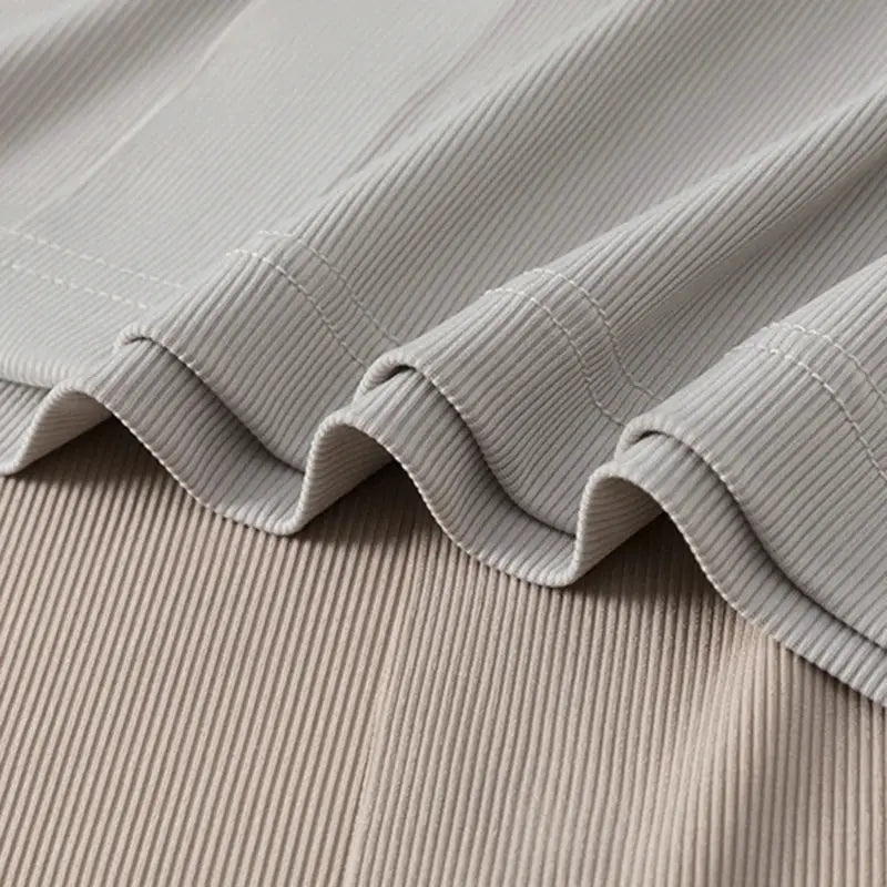 Simples Market men's polo shirt fabric close-up in light gray ribbed knit, solid color style