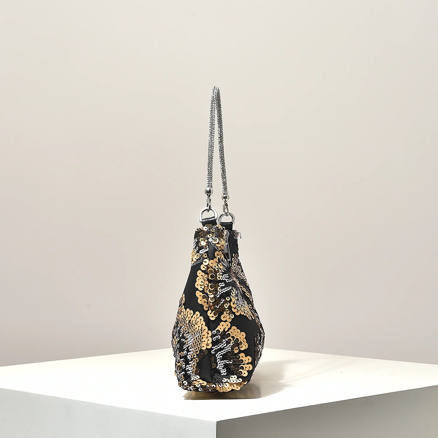 Shoulder bag with gold and silver sequin floral embroidery on black fabric and silver chain straps