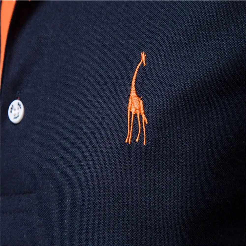 Navy men's polo shirt with orange giraffe embroidery on chest; short sleeves.