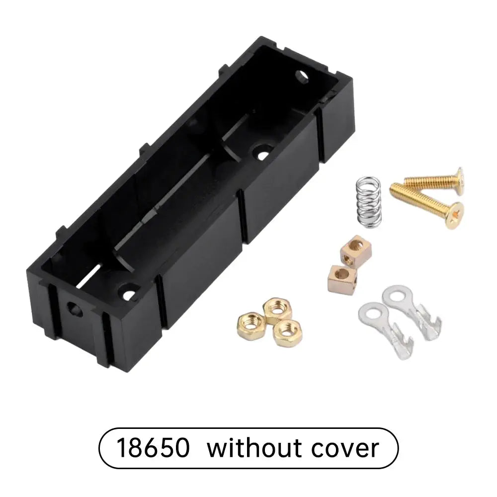 Battery holder for 18650/21700 cells, black plastic, solder-free, includes screws, springs and brass connector pieces.