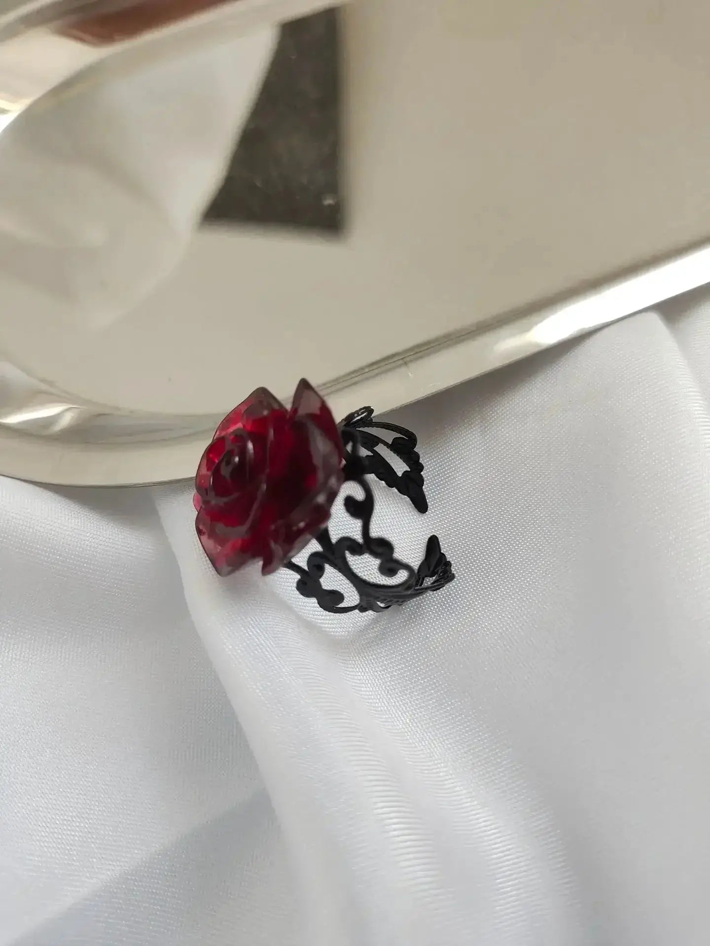Goth punk open ring with red crystal rose on a black filigree band