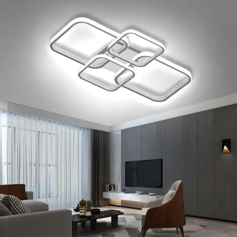 Modern LED ceiling light fixture with four square heads in black and white for bedroom or living room.