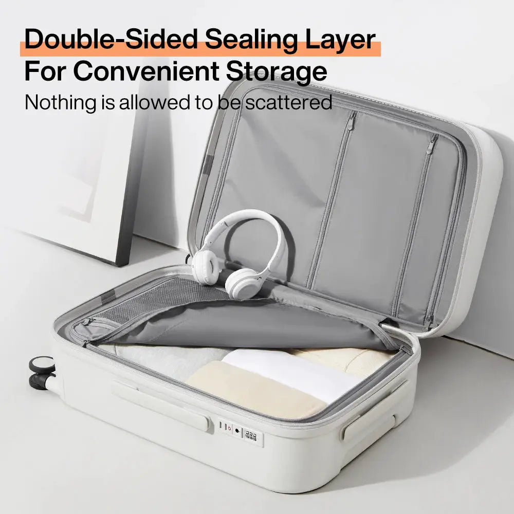 Mixi 2024 white hard-shell rolling carry-on suitcase opened to gray interior with a pair of white headphones inside.